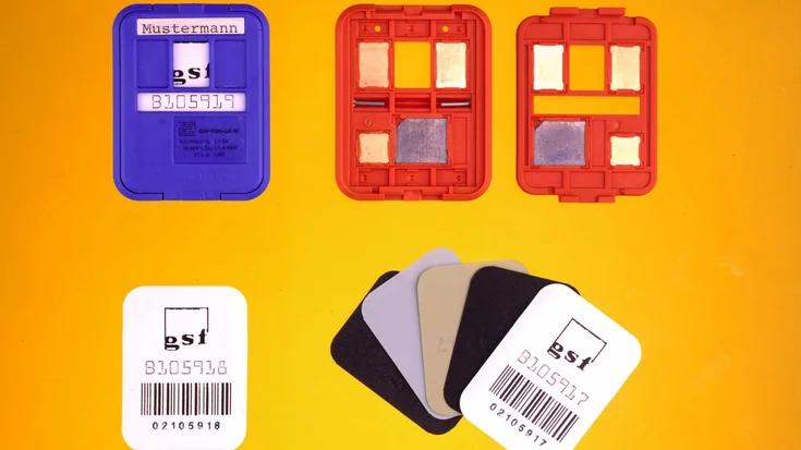 X-ray film dosimeter badges and opened cassettes with different metal filters inspected by a machine vision system.