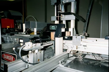 Machine vision inspection system with three cameras integrated into an automated conveyor setup.