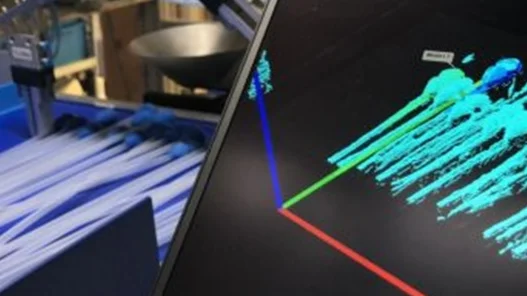 Bin picking application using machine vision to locate and grip medical catheters in random orientations for automated packaging.