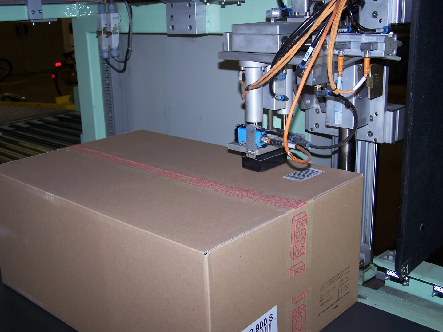 Package label with barcode and printed text used for automated barcode reading and OCR.