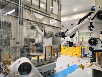 Robotic manufacturing cell assembling satellite panels with optical solar reflectors using machine vision.