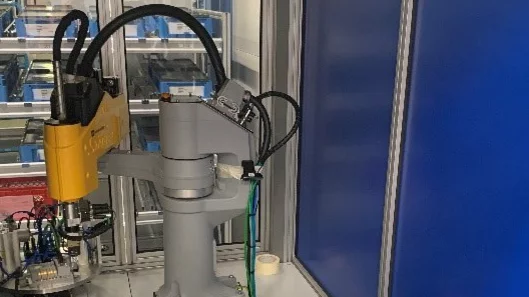 Vision-based assembly system with automatic connecting rod handling and eccentric press integration.