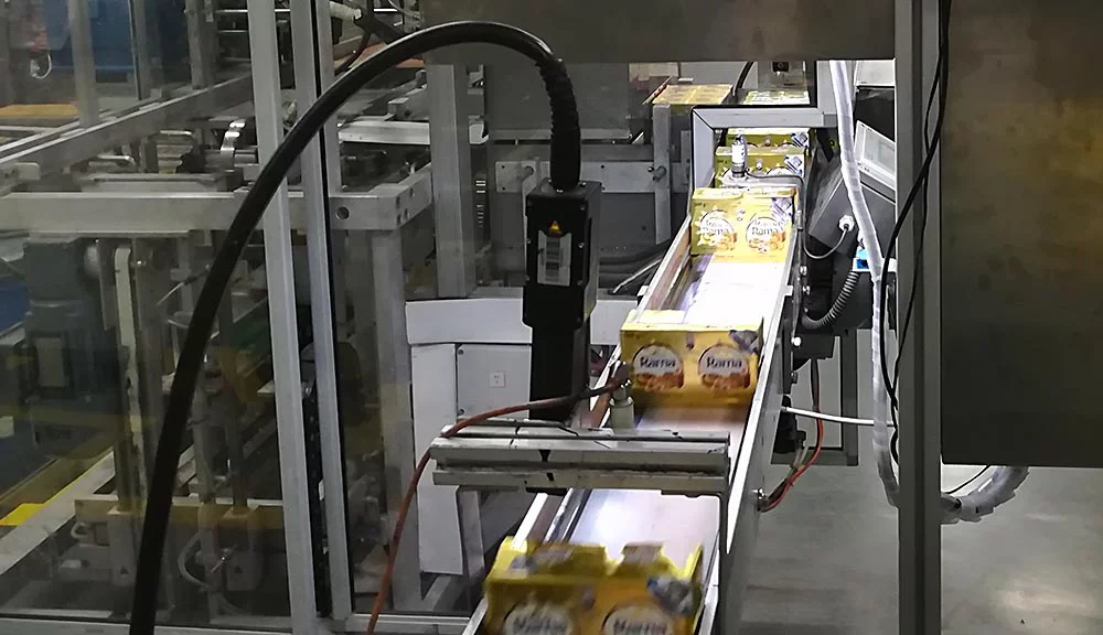 Machine vision system validating printed text on margarine packages on a food production line.