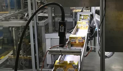 Machine vision system validating printed text on margarine packages on a food production line.