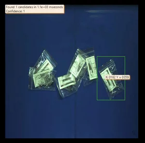 Hand-eye calibration enabling precise alignment between camera and robot for accurate gripping of accessory bags.