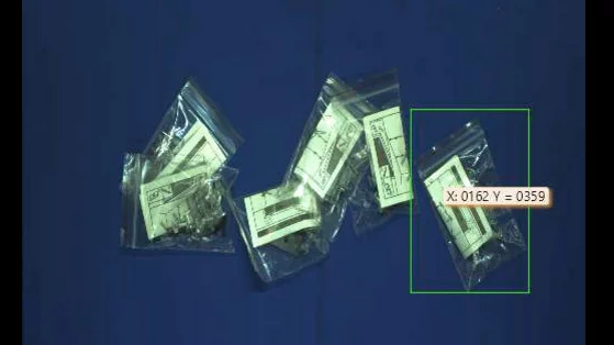 Hand-eye calibration enabling precise alignment between camera and robot for accurate gripping of accessory bags.