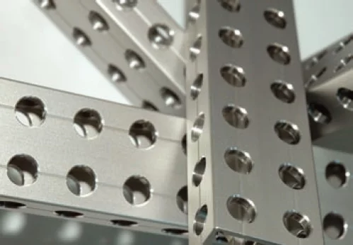 Precision boreholes in metal profiles inspected with 3D machine vision.