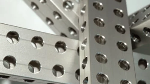 Precision boreholes in metal profiles inspected with 3D machine vision.