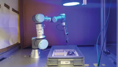 Pick-and-place robot cell with controlled illumination for reliable machine vision–based implant recognition.