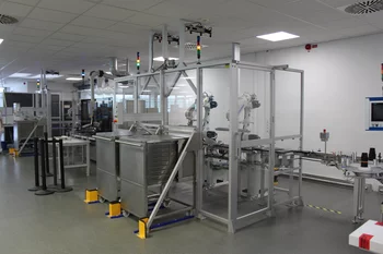 Automated robot cell handling vaccine vials with machine vision.