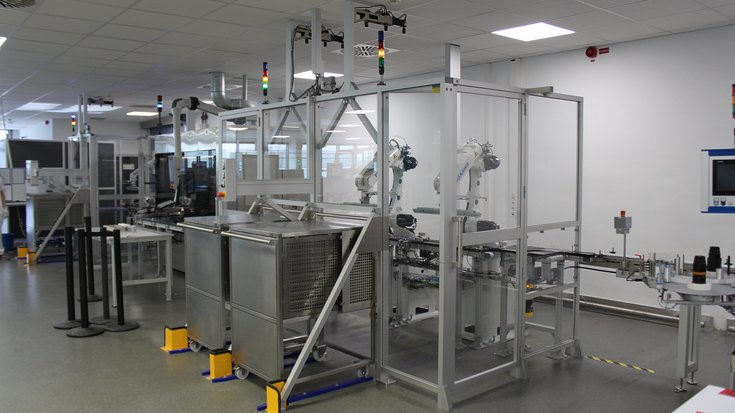 Automated robot cell handling vaccine vials with machine vision.