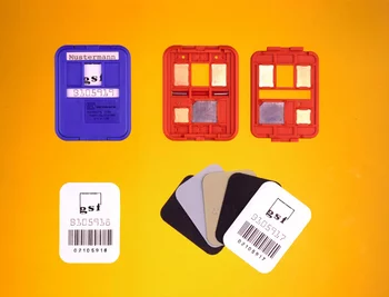 X-ray film dosimeter badges and opened cassettes with different metal filters inspected by a machine vision system.