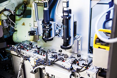 A high-resolution camera with a telecentric lens for accurate inspection of automotive parts in the production line.