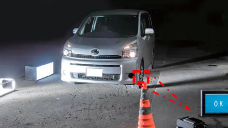 Vehicle passing a roadside machine vision system that inspects tires automatically for roadworthiness.