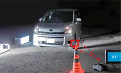 Vehicle passing a roadside machine vision system that inspects tires automatically for roadworthiness.