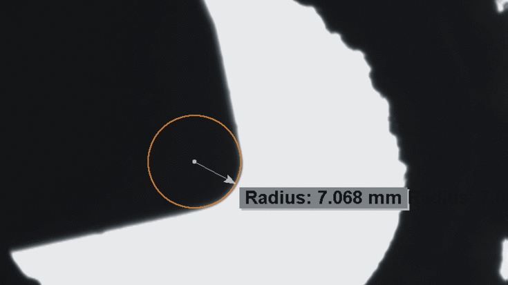 Machine vision measurement of the cutting edge radius and angle of an indexable insert using subpixel accuracy.