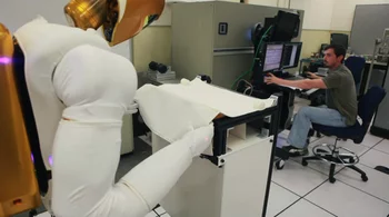 Robonaut R2 being tested in a laboratory environment using stereo vision and TOF data for precise object handling.