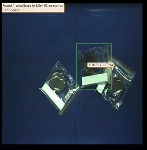 Object detection of accessory bags using MVTec HALCON to select optimal candidates for robotic gripping.