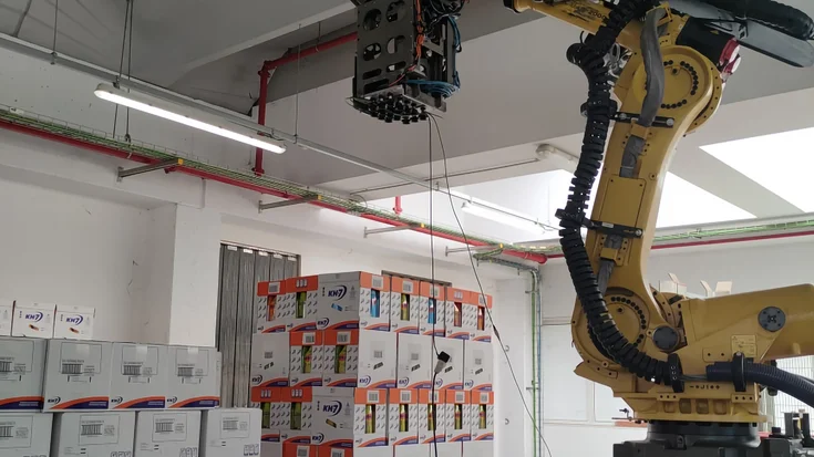 Robot depalletizing cartons layer by layer using machine vision in a logistics environment.