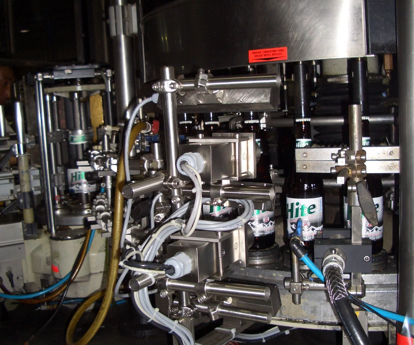High-speed bottling plant in operation with integrated machine vision inspection.