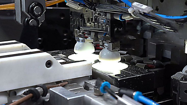 Bottle caps inspected by machine vision to verify print quality in beverage production.