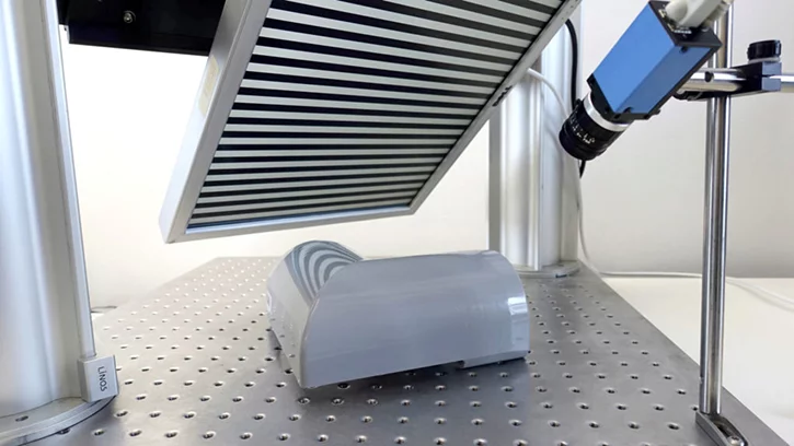 Deflectometry detects defects on reflective surfaces by analyzing light patterns.