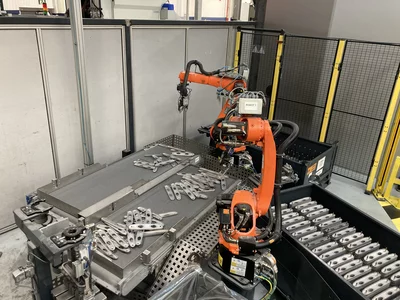 Fully automated bin picking system using industrial robots and 3D machine vision for precise gripping of unsorted parts.
