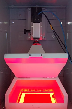 Wafer inspection station using backlight illumination to detect cracks and edge defects in silicon wafers.